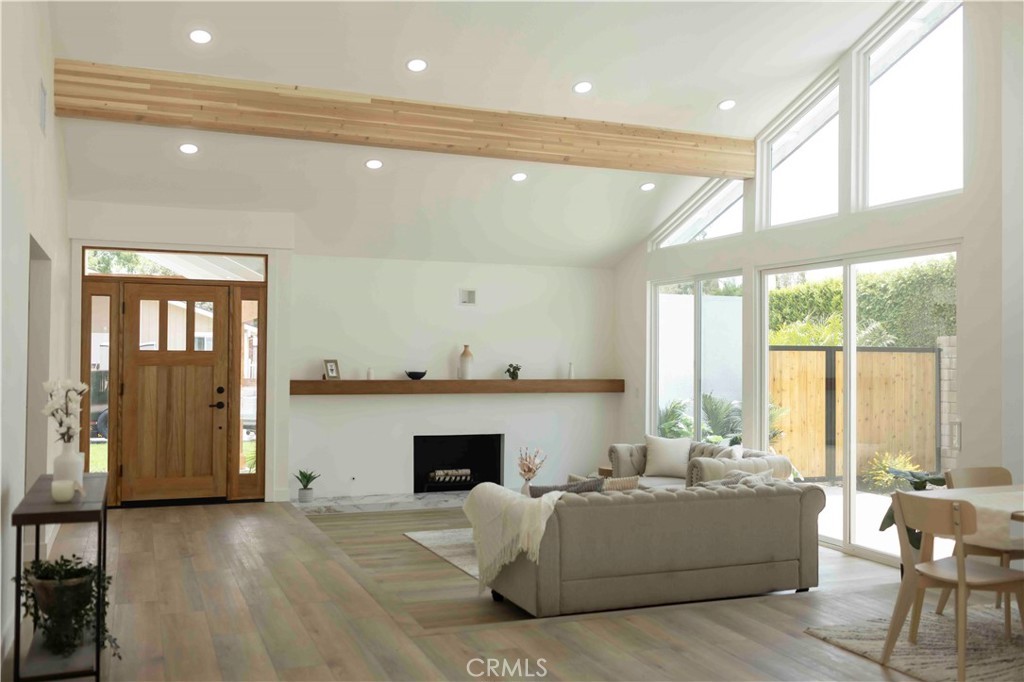 Remodeled living room with beam