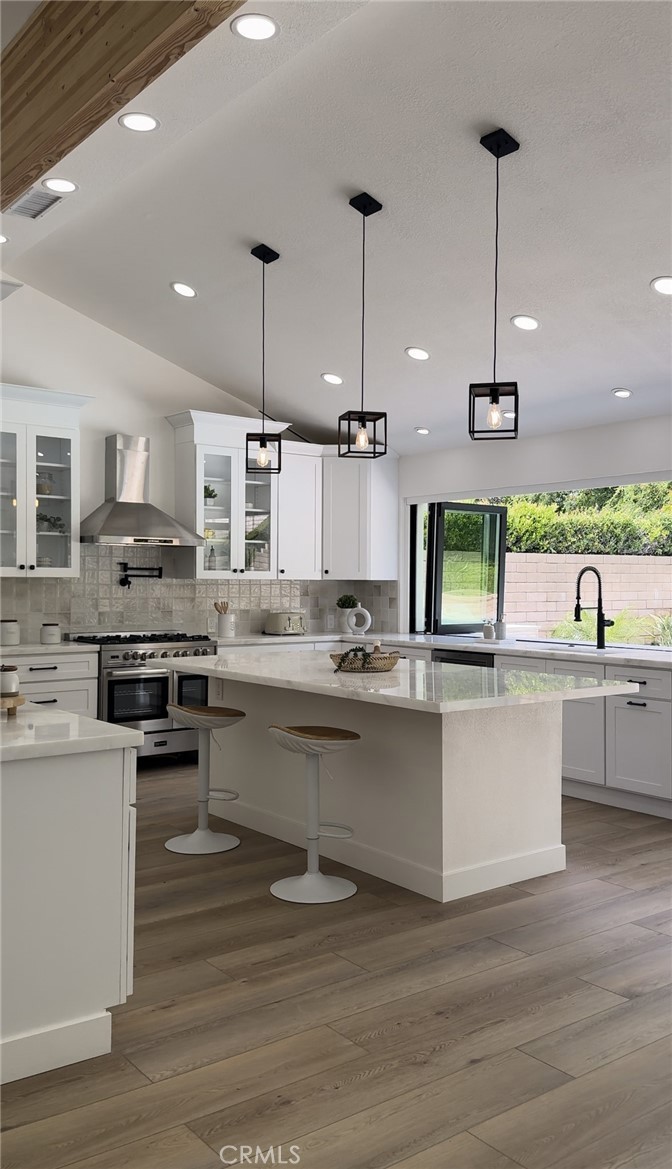 Kitchen island with pendant lighting after a full remodel